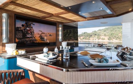 Skylounge on motor yacht King Benji with al fresco dining area and panoramic views 