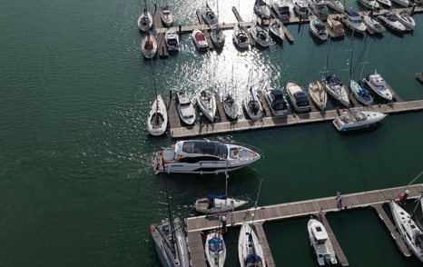 Fairline Targa 58 GTO approaching its marina berth from above