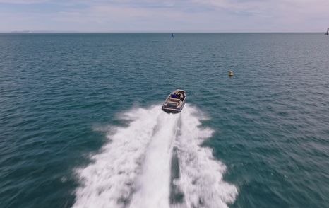 Evene Origin 71 running at speed across Studland Bay during time trial