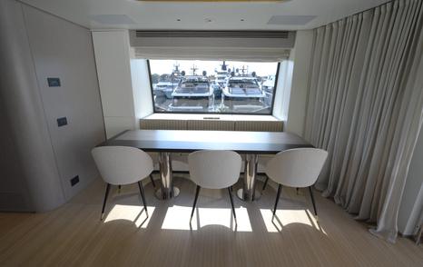 Benetti Oasis 34M upper saloon dining area with harbour views and flexible guest seating.