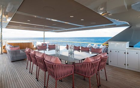 Superyacht Oscar's sundeck with shaded alfresco dining 