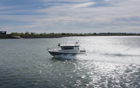 Botnia Targa 32 racing across the water with a long white wake during YachtBuyer's used boat challenge.