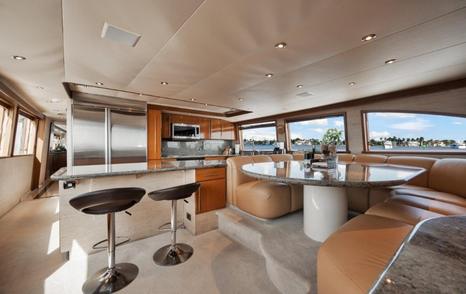 Motor yacht Island Girl's upper deck seating and bar area