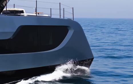 Sunreef Ultima 88 forward hull section with large dark glazing and rounded bow