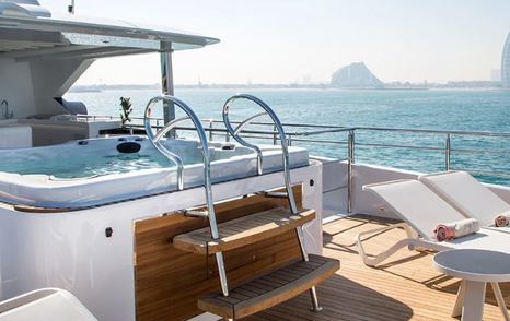 A Jacuzzi situated on the exterior of a Majesty 140 luxury yacht