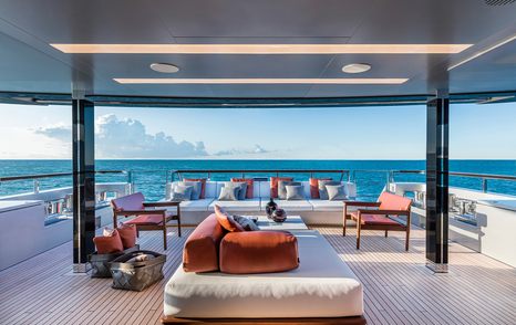 Riva 50Metri Superyacht main aft deck with sunpads and shaded seating 