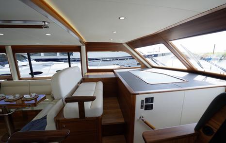 Grand-Banks-GB62-Flybridge-Review-lower-helm-bench-seating
