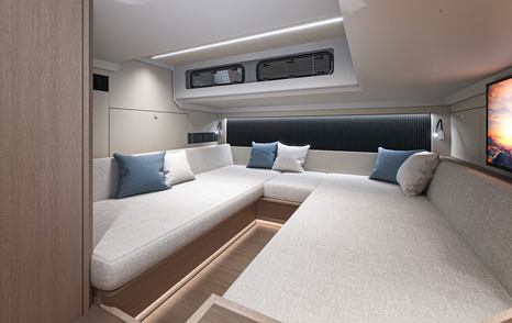 Rendering of new Beneteau Gran Turismo 40 motor yacht cabin with U-shaped bed