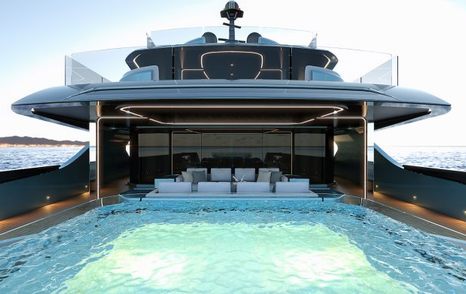 rendering of the pool in front of seating area on the aft deck of the S702 with view of deck above