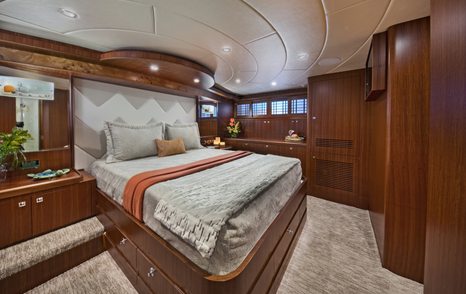 A guest stateroom on board a Johnson 110 Skylounge yacht