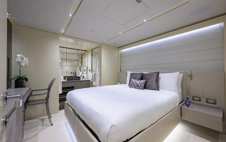 Guest cabin on board motor yacht Phoenix with desk and sink