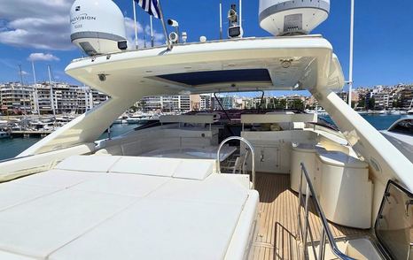 Bleu Blanc flybridge with sunpads, seating, and helm station