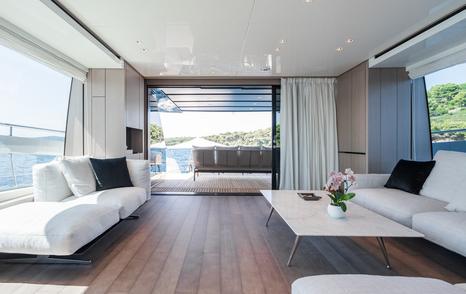 Motor yacht Fitline main saloon entrance with glass sliding doors