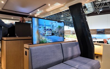 Pop-up television unit integrated behind the cockpit seating on the Aiata Sunfinder 50.