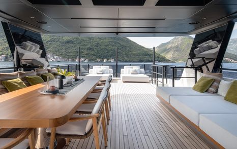 Superyacht Gisa's upper deck dining area and sunpads 