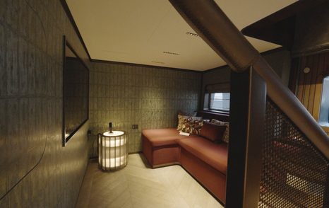 Sirena 118 lower owner’s lounge beneath the duplex staircase