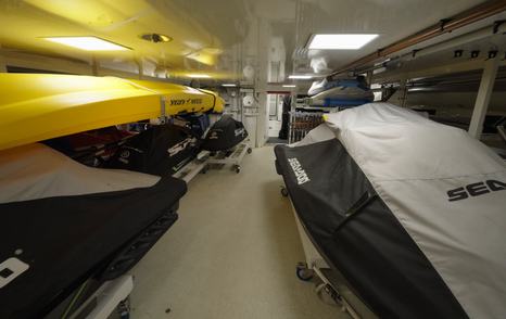 Water toys storage area on the Amels 242 Casino Royale with jet skis and equipment in the tender garage.