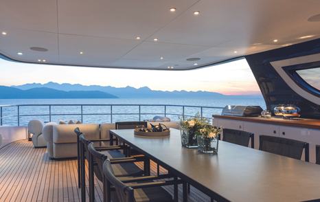 Benetti Oasis 34M motor yacht sundeck with shaded seating and alfresco dining