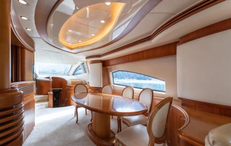 Motor yacht Senior S main saloon wooden dining table and chairs 