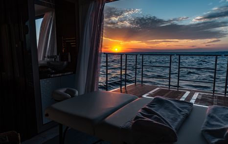 Sunset from balcony on superyacht TATIANA