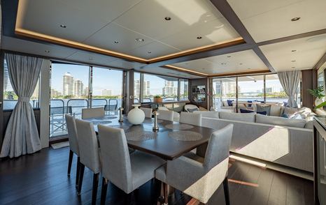 Motor yacht Mandala's main saloon dining table 