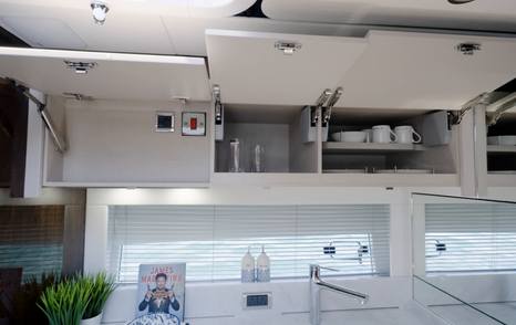 Overhead lockers in the Fairline Targa 47 GT galley providing crockery storage