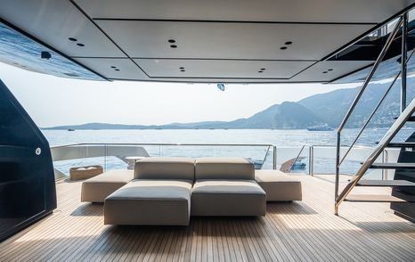 Superyacht Ami's aft deck with shaded seating