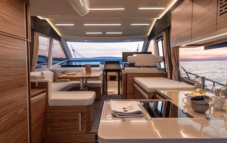 Inside Greenline's 45 Coupe with seating and kitchenette 