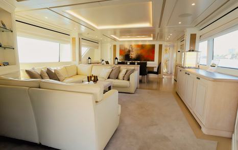 Motor yacht Lady Alina's main saloon with cream sofas 