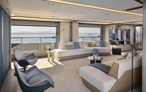 Azimut Grande Trideck motor yacht main saloon with chairs and white sofas