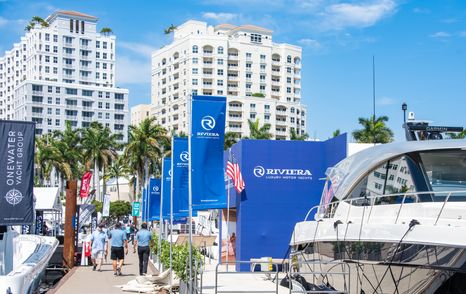 Palm Beach International Boat Show 2026 walk way with yachts docked and palm trees