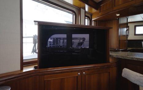 Nordhavn 75 EYF saloon with hidden television cabinet and handcrafted timber cabinetry