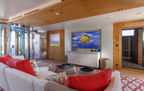 Superyacht Atomic's entertainment area with mounted TV 