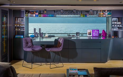 Raised seating and large window onboard superyacht MAVERICK