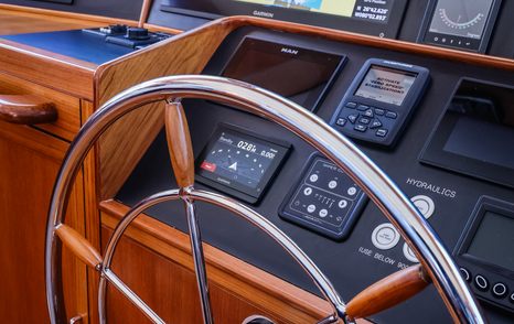 Fleming 85 lower helm station with stainless wheel and navigation controls
