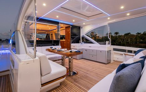 Riviera 6800 Sport Yacht Platinum Edition motor yacht aft deck with L-shaped alfresco dining area 