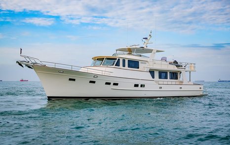 Fleming 85 open flybridge motor yacht profile with classic long-range cruiser styling