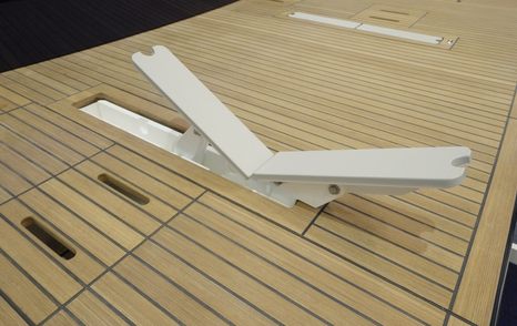 Chocks pop out of the deck to hold the tender 