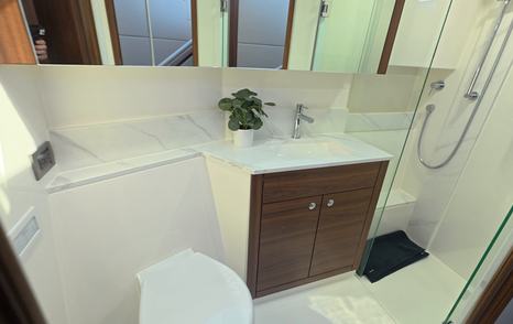 Maritimo M50 guest bathroom with shower, vanity unit and storage cabinet