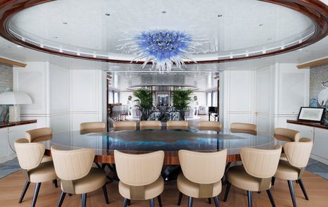 Superyacht Ahpo interior dining area with circular table