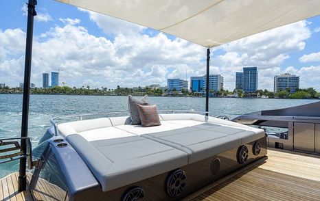 Motor yacht Shine's shaded aft sunpads with canopy