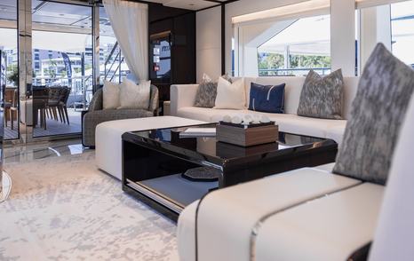 Gulf Craft's Majesty 120 motor yacht interior with L-shaped sofa