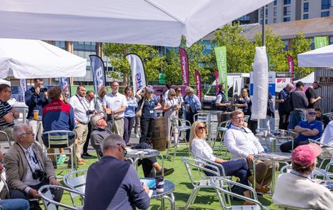 Hospitality area with many visitors seated and standing at South Coast & Green Tech Boat Show