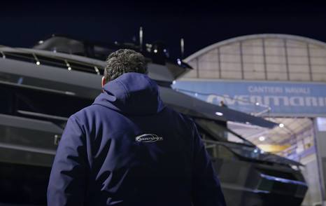 Man looking at Motor Yacht Unleash the Lion before launch