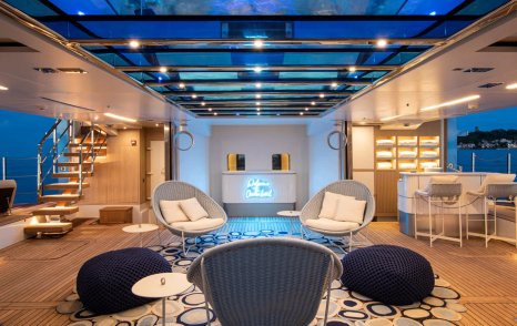 Superyacht Oceanbird's lounging area beneath glass bottom pool