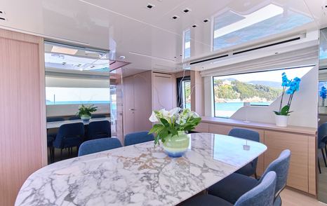 Motor yacht Estia's saloon dining area