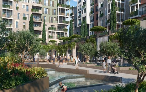 Overview of Boka Place water feature in courtyard, surrounded by blocks of apartments and trees