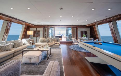 CRN Superyacht Odyssey upper saloon with pool table and beige seating