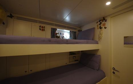 Benetti Oasis 34M crew cabin with over-under bunks, storage lockers and accommodation for professional crew.
