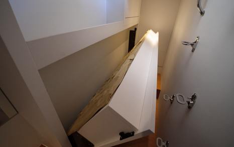 Solaris-Power-60-Coupe-Review-crew-berth-opening-and-steps-leading-up